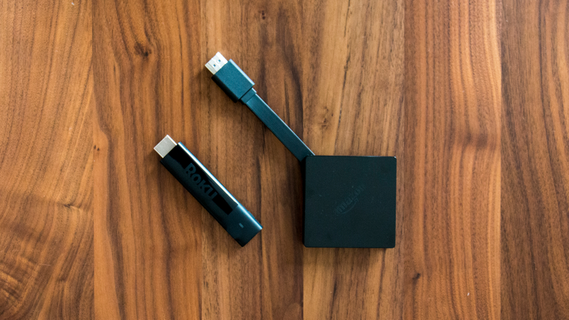 The new Roku Streaming Stick+ next to the new Amazon Fire TV.